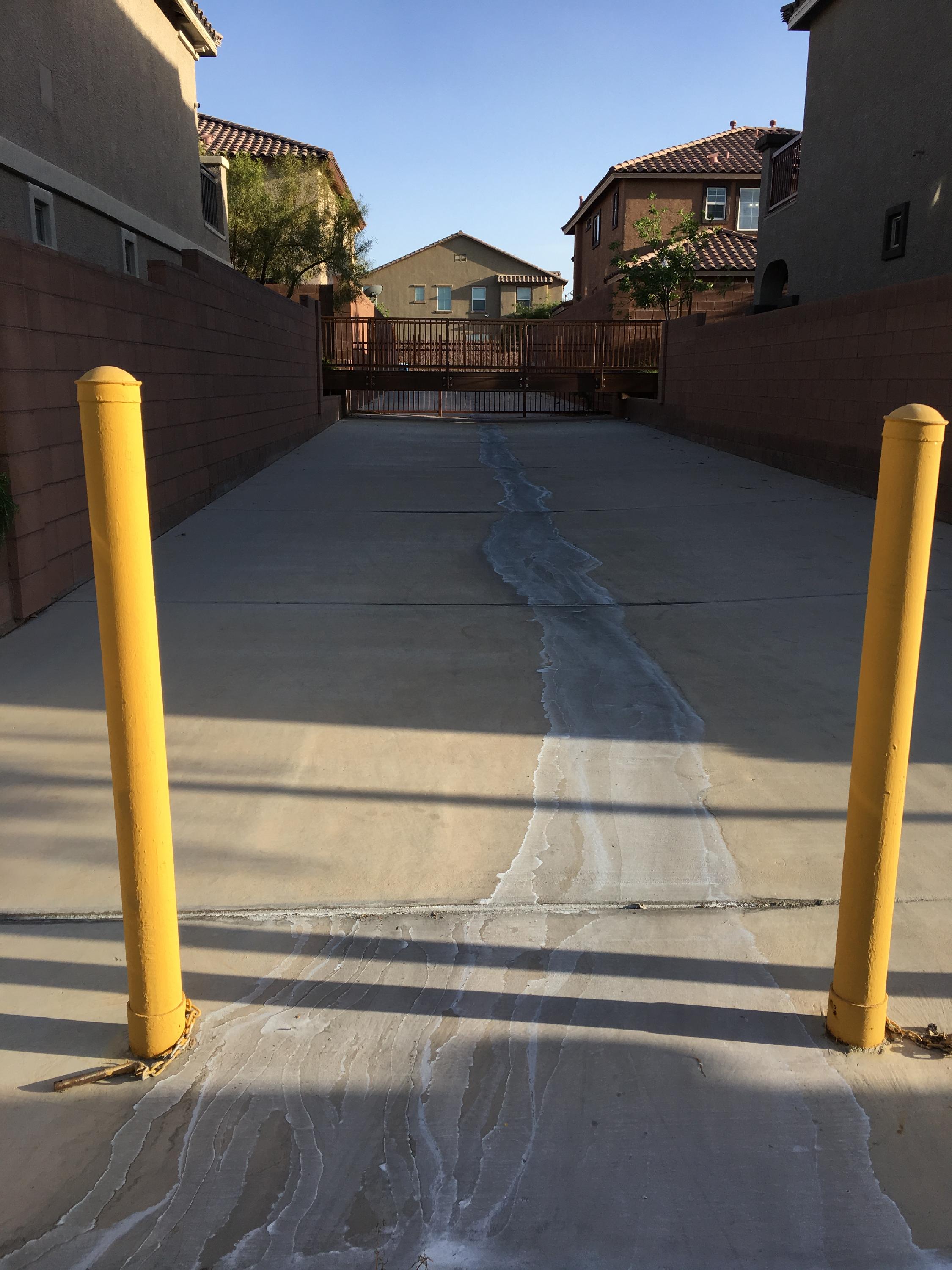 Residue left behind from an illicit discharge that was improperly disposed of in a residential stormwater conveyance.